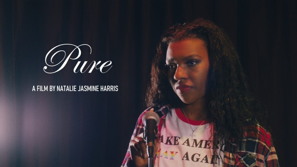Celeste (Mikayla Lashae Batholomew) is standing on a stage with a curtain behind her; her hair is loose and she is wearing a t-shirt that says MAKE AMERICA GAY AGAIN (with GAY depicted in rainbow colors), with a plaid buttondown over the t-shirt. The name of the film, “Pure”, is overlaid, along with the text “a film by Natalie Jasmine Harris”.