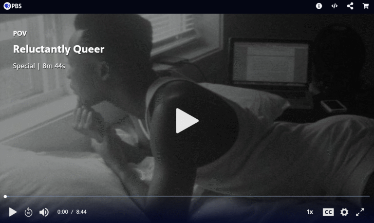 Screenshot of a black-and-white online PBS POV video that has not yet been played, “Reluctantly Queer”. The video is 8 minutes and 44 seconds. The first image is of a Black man wearing a white tank top, lying on his bed and looking out the window.